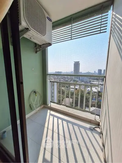 Charming balcony with city view, perfect for relaxation and enjoying the skyline.