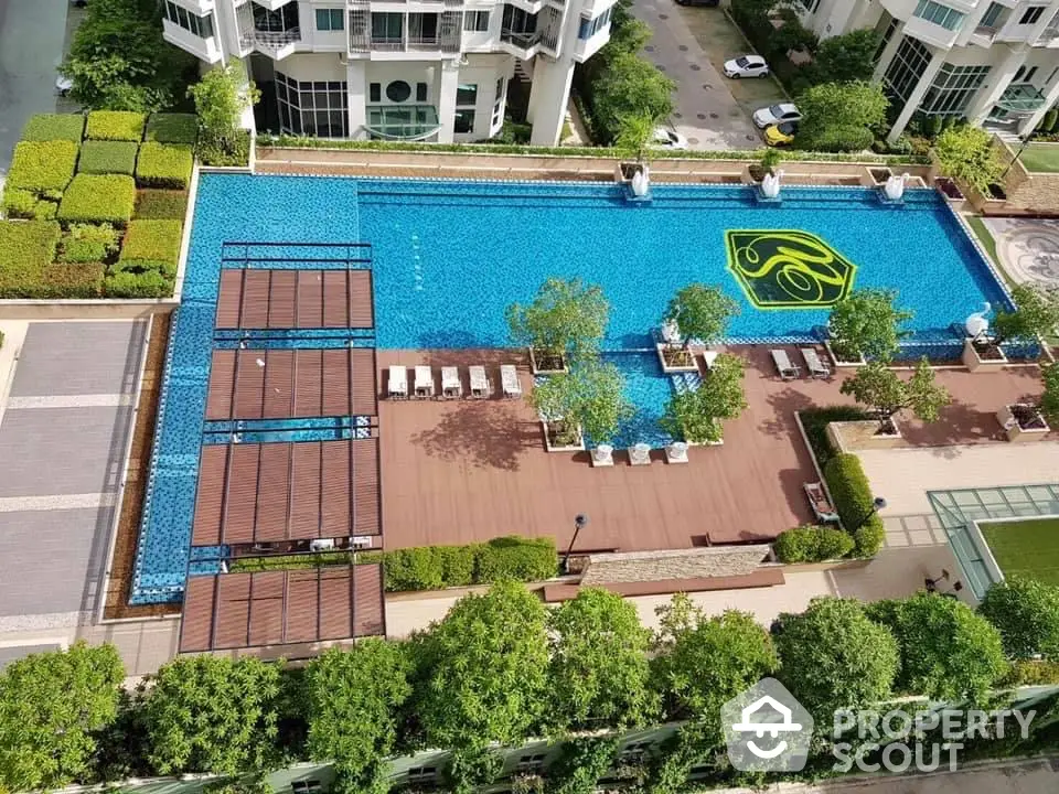 Luxurious residential complex with stunning rooftop pool and lush greenery