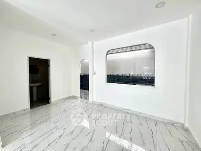 Spacious interior with modern marble flooring and open kitchen layout