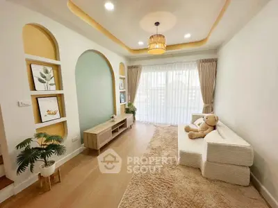 Charming living room with cozy decor and natural light, featuring stylish furniture and elegant design.