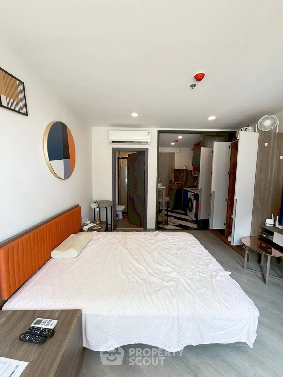 Modern studio apartment with stylish decor and in-unit laundry facilities.