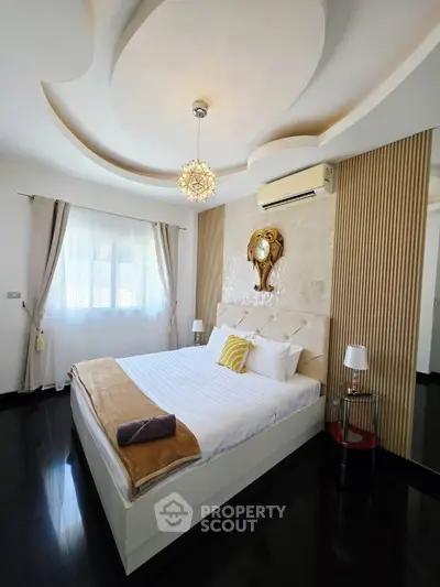 Luxurious bedroom with elegant ceiling design and stylish decor