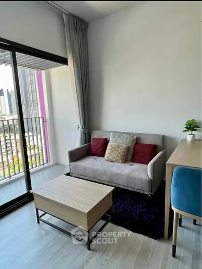 Modern living room with balcony view in urban apartment