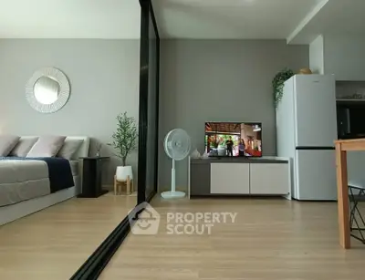 Modern open-plan living room with sleek design and natural light