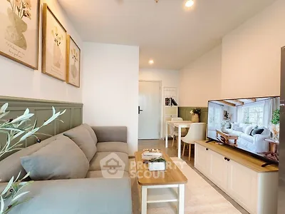 Charming living room with cozy sofa and stylish decor, perfect for relaxation and entertainment.