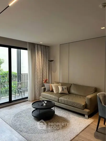 Modern living room with cozy sofa and balcony view