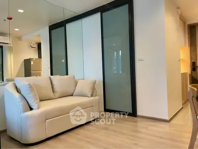 Modern living room with cozy beige sofa and sliding glass doors