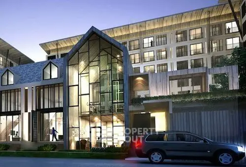 Modern architectural building with sleek glass facade and stylish exterior lighting.