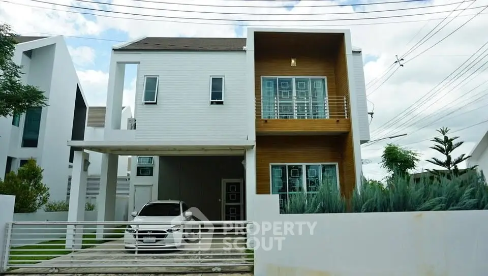 Modern two-story house with carport and stylish facade