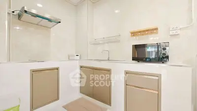 Modern kitchen with sleek cabinets and stainless steel appliances