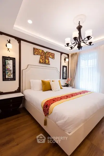 Luxurious bedroom with elegant decor and natural light