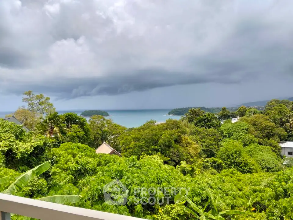 Stunning ocean view from lush green balcony, perfect for serene living.