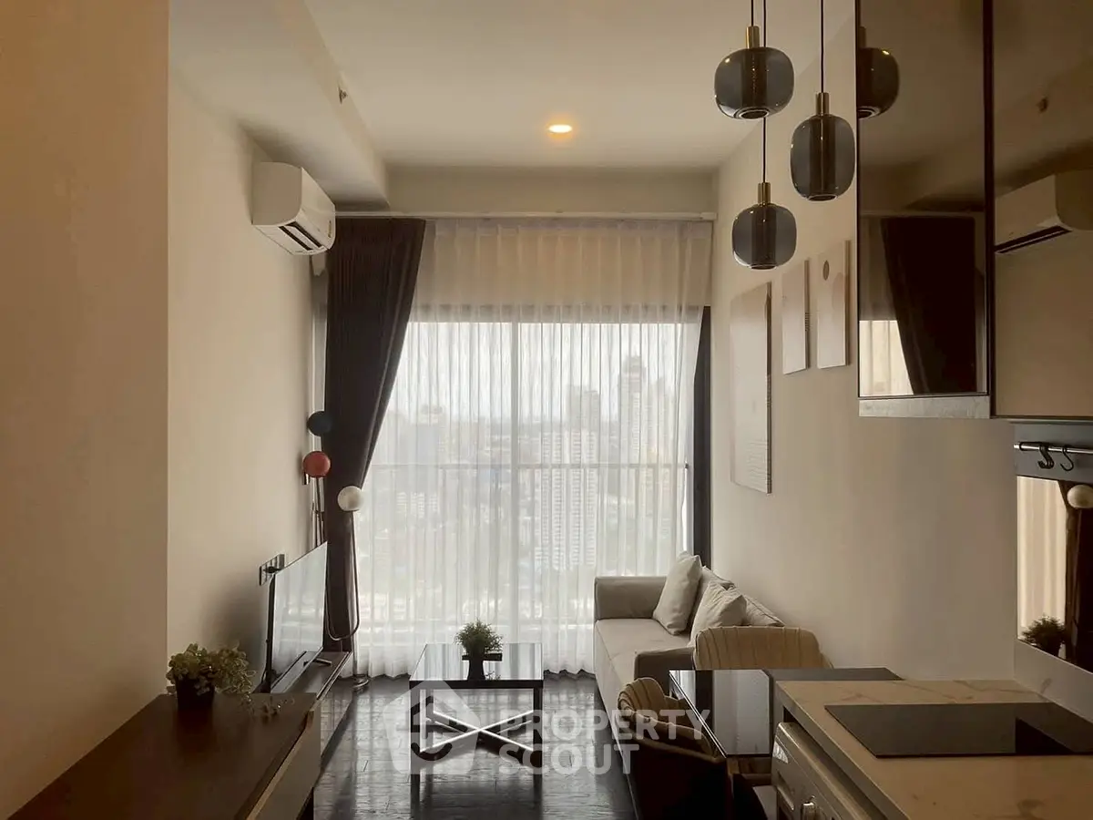 Modern living room with city view, stylish lighting, and cozy seating area.