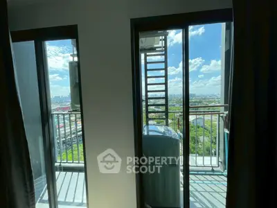 Stunning balcony view with cityscape and lush greenery, perfect for relaxation and enjoying the outdoors.