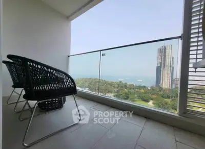 Spacious balcony with stunning city and sea view, perfect for relaxation and enjoying the skyline.