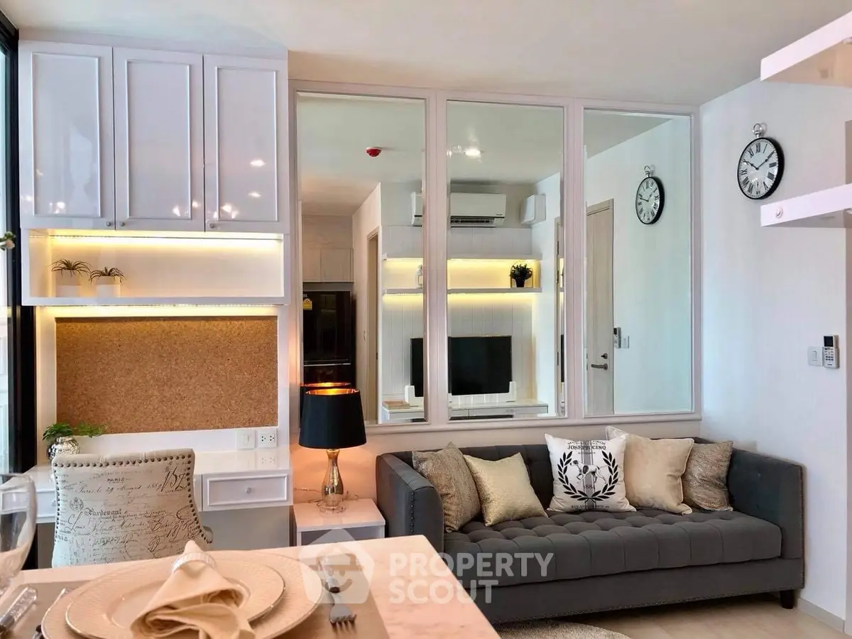 Modern living room with stylish decor and cozy seating area, perfect for relaxation and entertainment.