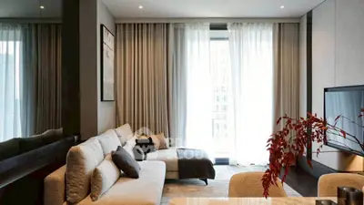 Elegant modern living room with large windows and stylish decor