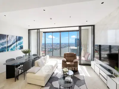 Luxurious living room with stunning city view, modern furniture, and elegant decor in high-rise apartment.