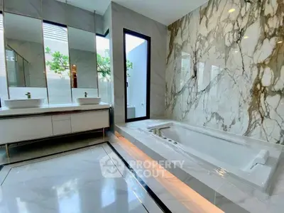 Luxurious modern bathroom with marble accents and elegant fixtures