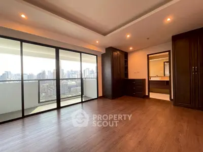 Spacious modern living room with city view and elegant wooden flooring