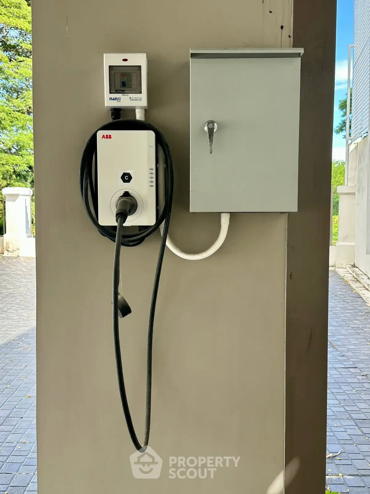 Modern electric vehicle charging station in residential parking area