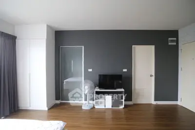 Modern minimalist living room with sleek design and wooden flooring