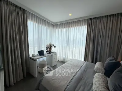 Luxurious bedroom with panoramic city view and elegant decor