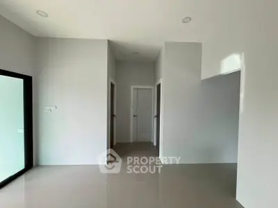 Spacious modern interior with sleek design and neutral tones, perfect for customization.