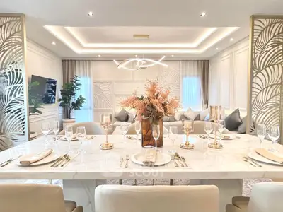 Luxurious modern living room with elegant dining setup and stylish decor