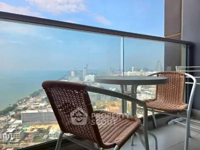 Stunning high-rise balcony with breathtaking city and ocean views, perfect for relaxation and entertainment.