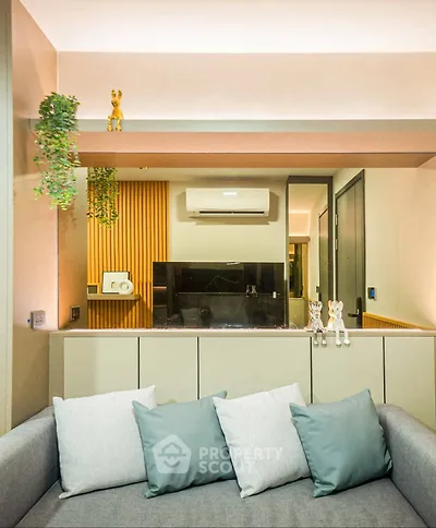 Modern living room with stylish decor and open kitchen layout