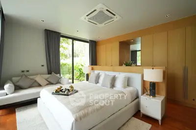 Luxurious bedroom with modern design, large windows, and elegant furnishings, perfect for relaxation and comfort.