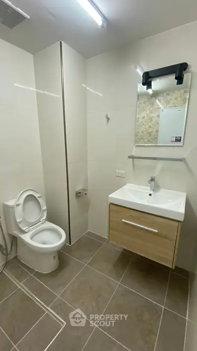 Modern bathroom with sleek fixtures and elegant tile flooring