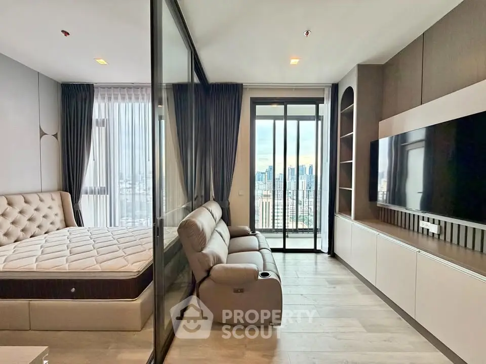 Modern condo interior with city view, featuring a cozy living area and stylish bedroom.