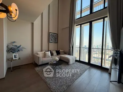 Luxurious living room with high ceilings and stunning city view