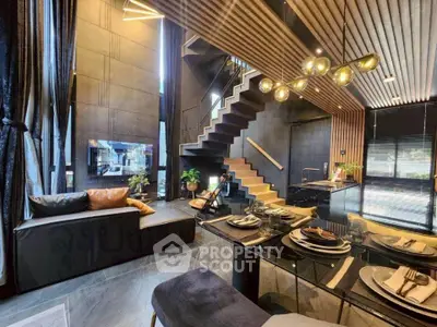 Luxurious modern living room with open kitchen and stylish staircase