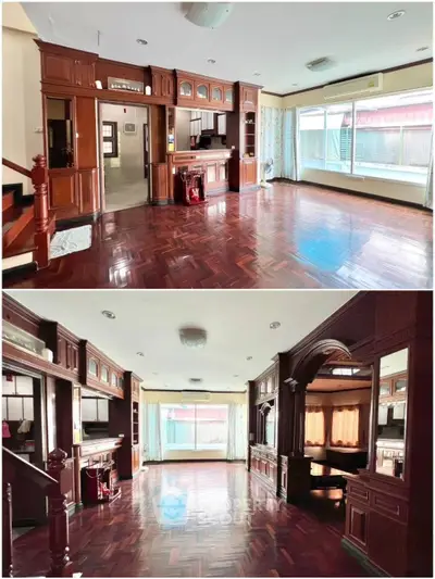 Spacious living room with elegant wooden flooring and built-in cabinetry, featuring large windows for natural light.