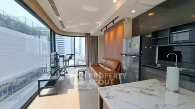 Modern living room with floor-to-ceiling windows and sleek kitchen in luxury apartment