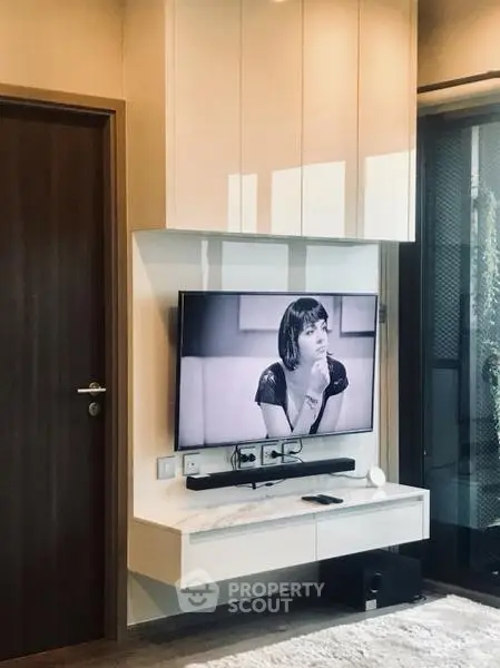 Modern living room with sleek TV setup and stylish decor