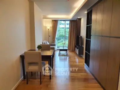 Spacious modern living room with wooden flooring and elegant furniture