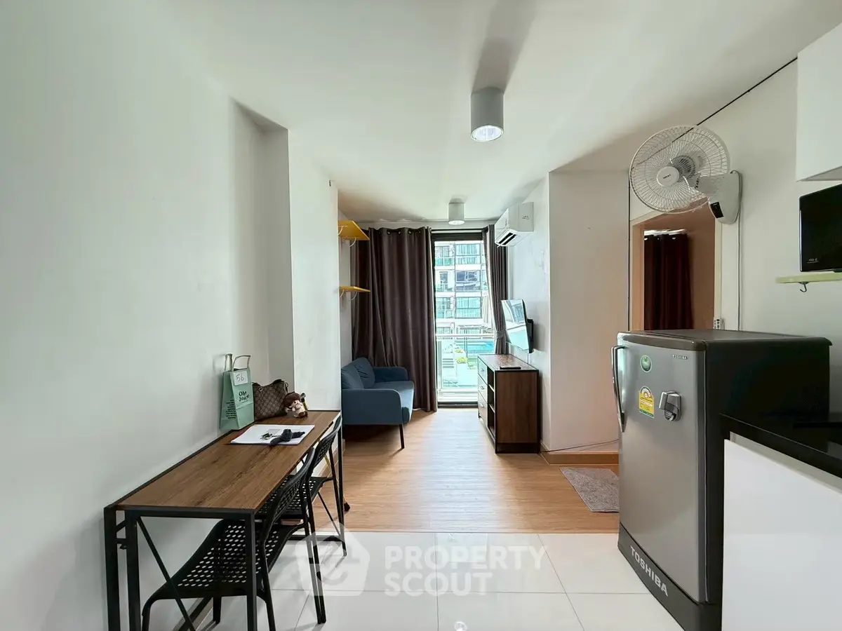 Modern studio apartment with open layout and balcony view