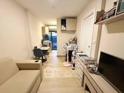 Modern living room with cozy seating and dining area, featuring stylish decor and natural light.