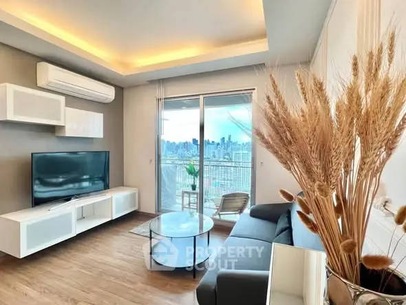 Modern living room with city view, sleek furniture, and ambient lighting.