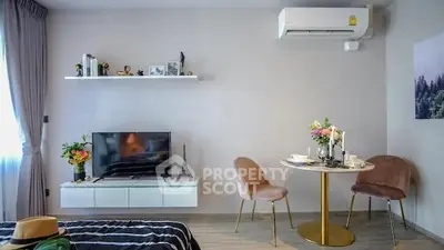 Chic modern living room with stylish decor and cozy dining area, perfect for urban living.