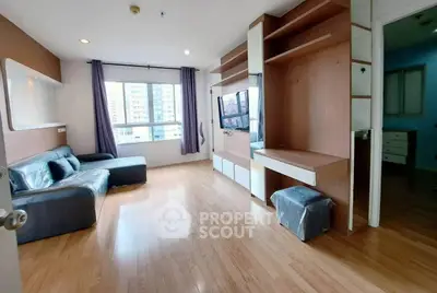 Spacious modern living room with wooden flooring and built-in entertainment unit.
