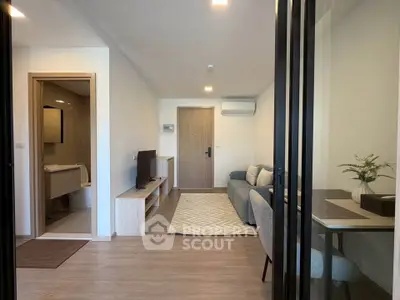 Modern living room with open layout and stylish decor in a contemporary apartment.