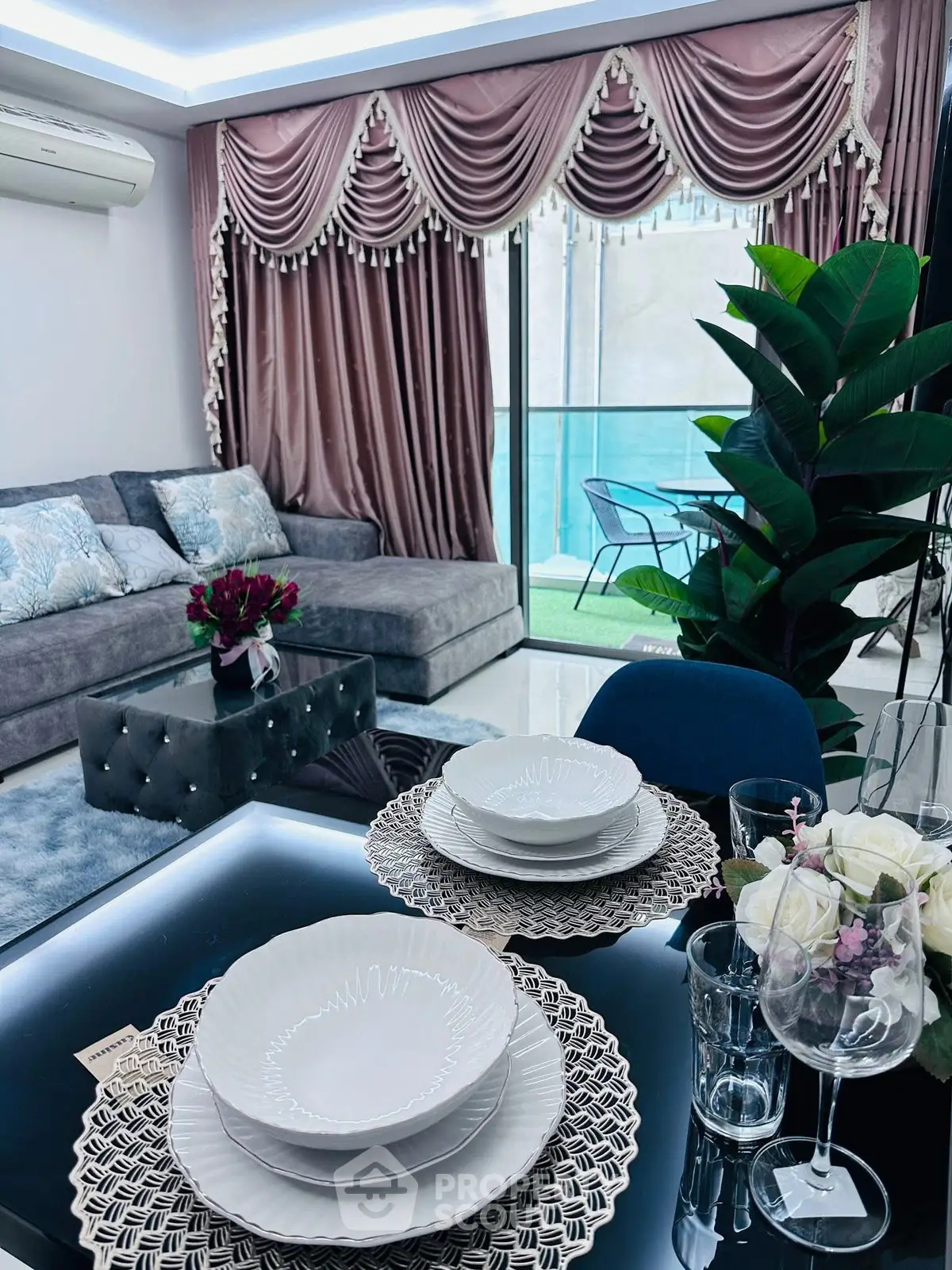 Luxurious living room with elegant decor and balcony view, perfect for modern living.