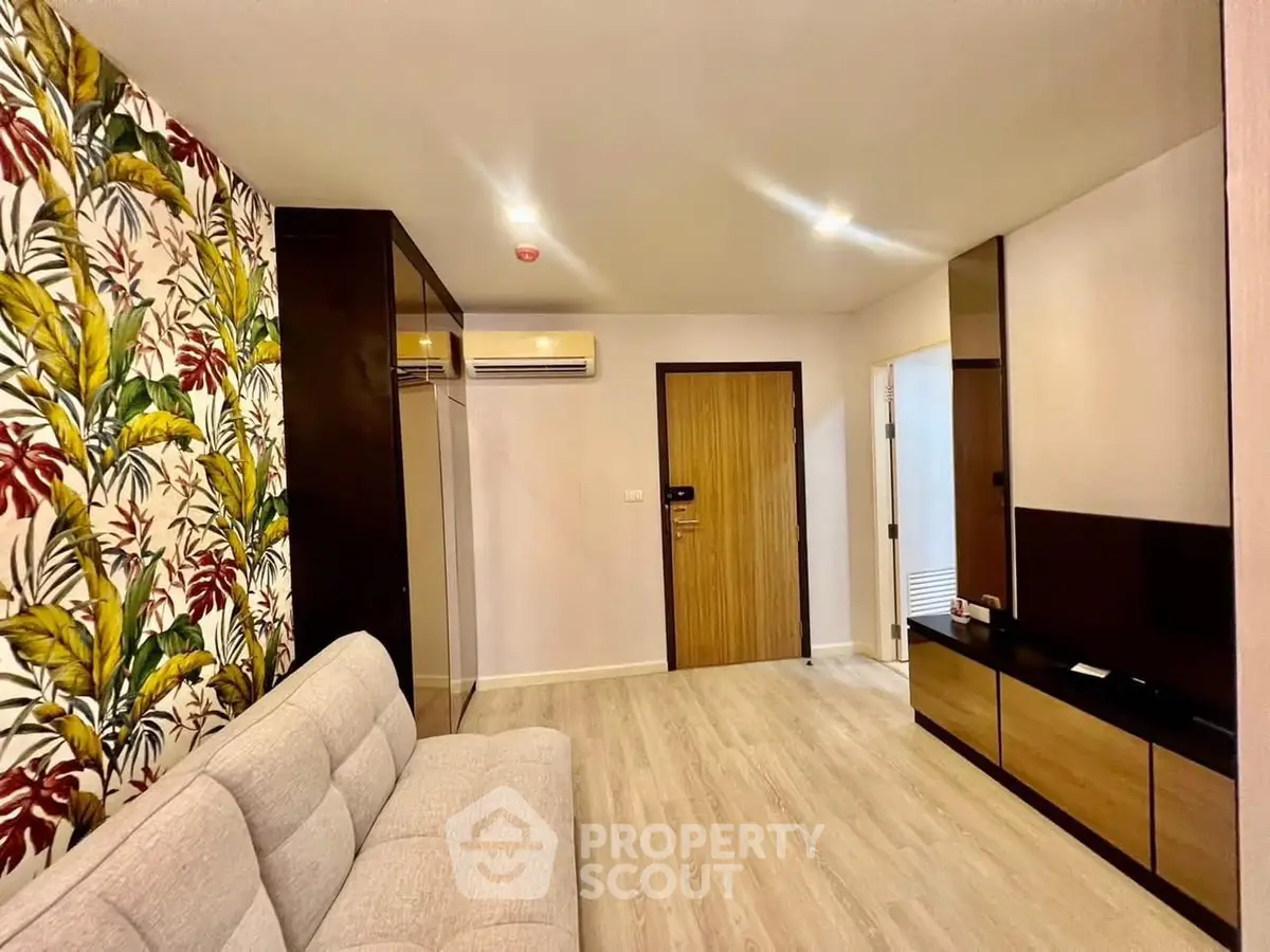 Stylish living room with floral accent wall and modern furnishings