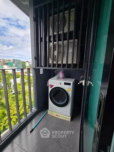 Modern balcony with washing machine and scenic view, perfect for urban living convenience.