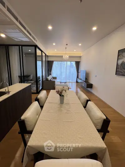 Spacious modern living room with elegant dining area and large windows